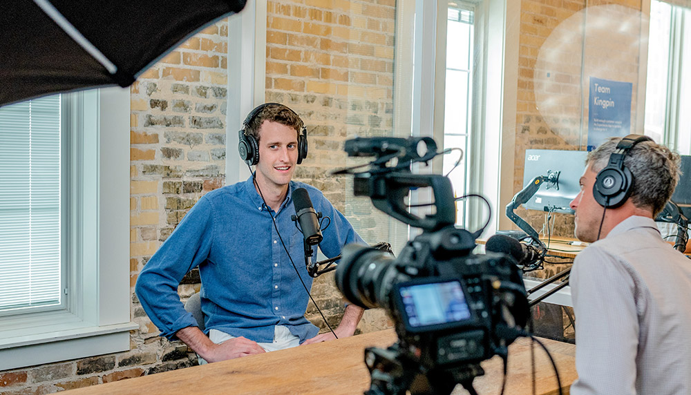 Young man making a podcast