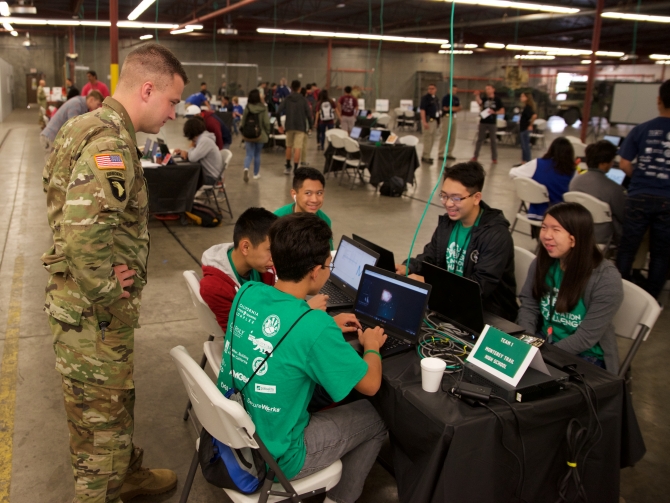 A CCIC team speaks with a member of the Army