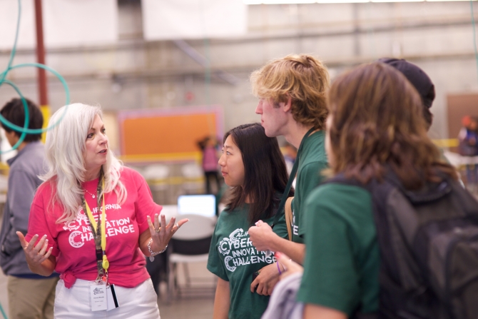 A CCIC coach speaking to a different team