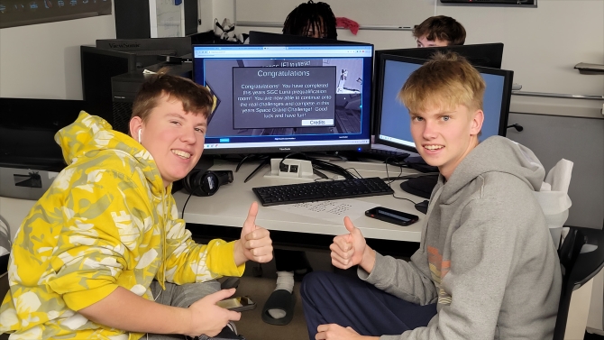 Kids doing a thumbs up
