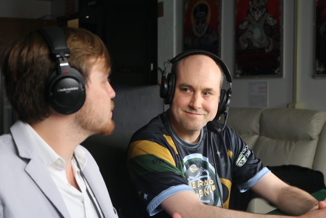 Two men with headsets on